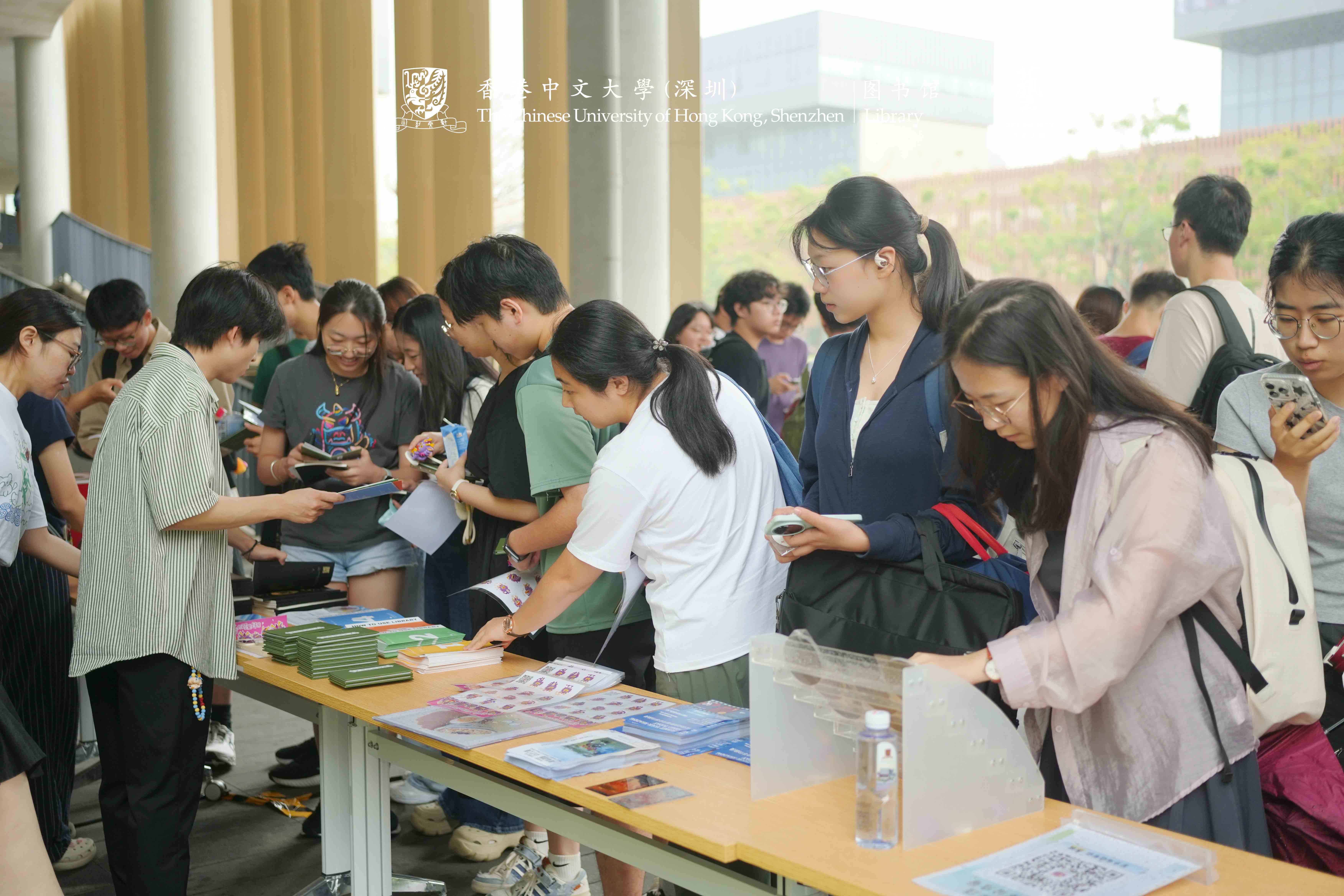 Students collecting library guides