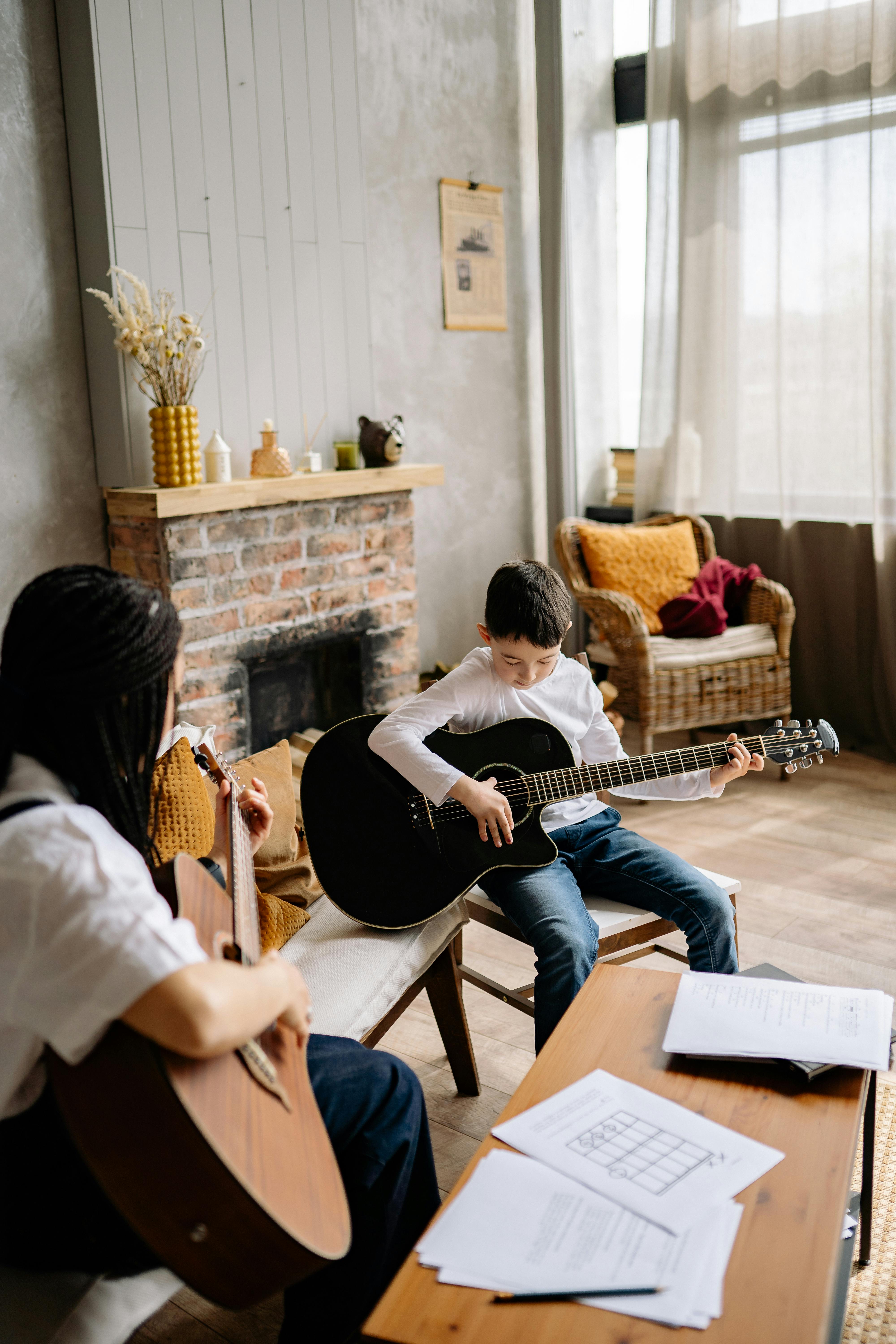 Music Therapist and a Child Playing Guitar Together