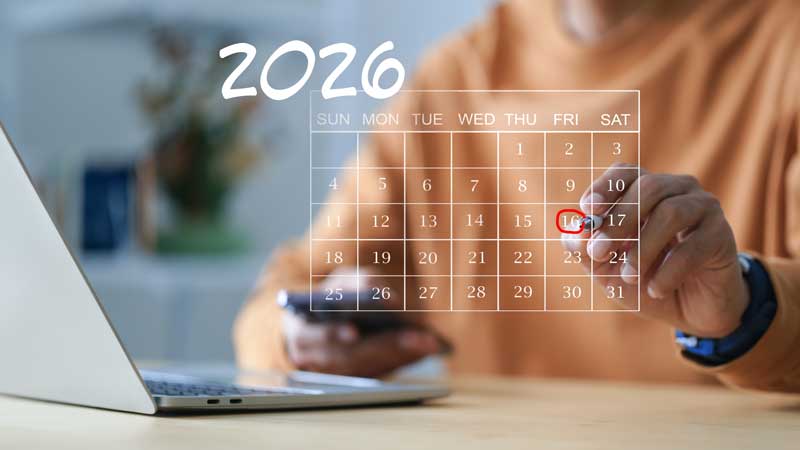 Person marking January 16, 2026, on a digital calendar while using a laptop and smartphone.