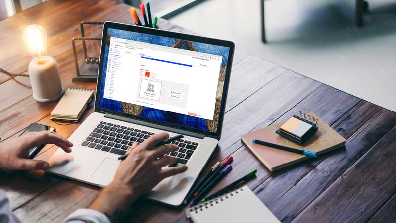 Person with laptop open looking at MyLearn assessments section
