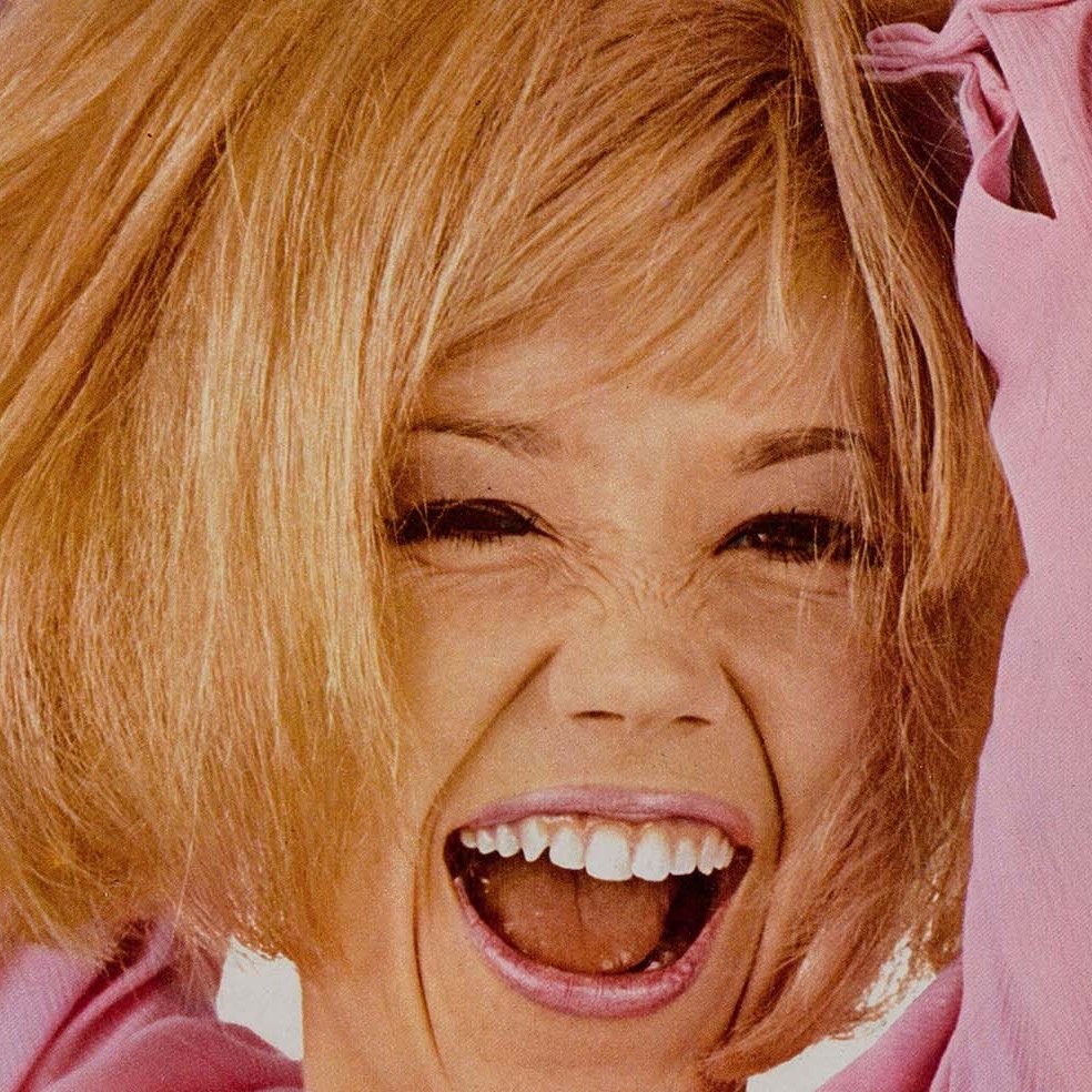 girlhood magazines and print culture database logo, colour photo of blonde woman smiling